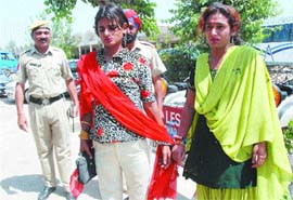 The two men, arrested by the district police, were allegedly duping some persons after impersonating themselves as women.