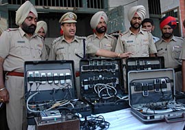 Police team with the equipment recovered from the accused.