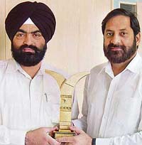 Allengers Medical Systems officials R.S. Kanwar and Suresh Sharma with the Century International Quality Era Award in Chandigarh on Friday.