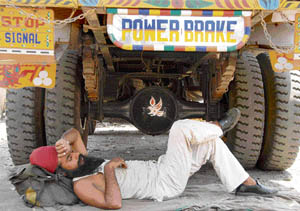 After a hard day’s drive in the April heat, a trucker takes out time for siesta in Chandigarh on Friday.