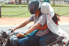 As temperatures rise in the Capital, some women prefer to cover their faces to ward off piercing sunrays. 
