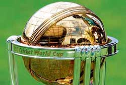 The Kensington Oval cricket stadium is reflected on the World Cup trophy before the final between Australia and Sri Lanka in Bridgetown on Saturday. Australia won the toss and elected to bat first as rain delayed the start of the match. 