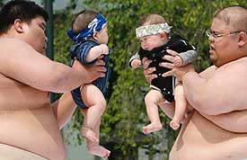 Babies, held by amateur sumo wrestlers, face each other during a baby-crying contest at Sensoji temple in Tokyo on Saturday. Eightyfour babies born in 2006 took part in the event which is held to pray for the babies health and growth. The winner of the contest is the baby who cries the loudest. 