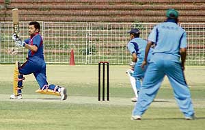 Vishal of Chandigarh Lawyers team plays a shot during Twenty-20 cricket match at Sector 16 Cricket Stadium in Chandigarh on Sunday. 