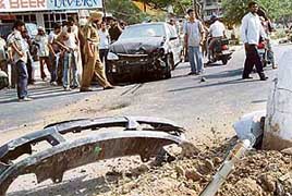 The damaged Indica car that rammed into an electricity pole on the road dividing Sectors 49 and 50 in Chandigarh on Sunday. 