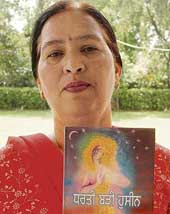 Dr Kulbir Kaur with her book Dharti Badi Hassin, which was released at the Chandigarh Press Club in Sector 27, Chandigarh, on Sunday. 