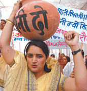 BJP activists carry dry pitchers to the Delhi Jal Board Headquarters in the Capital on Sunday. They are demanding the resignation of Delhi Chief Minster Sheila Dikshit and Delhi Jal Board chairman for failing to provide an adequate water supply.