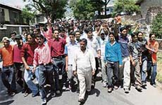 Taxi operators hold a protest march against the governments directive to install meters in taxis at Dharamsala
