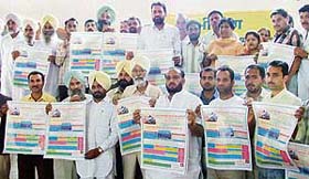 Krishan Kumar Bawa, president, All-India Bairagi Mahan Mandal, along with other functionaries releases a poster at the state-level meeting in Ludhiana