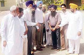 PWD minister Parminder Dhindsa interacts with a delegation of SAD activists near Ahmedgarh