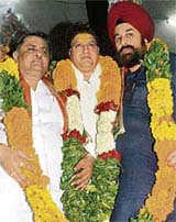 Rajinder Bhandari (centre), chief of the Punjab unit of the BJP who took over office in Chandigarh on Sunday. On the left is Manoranjan Kalia, minister for industries, while on the right is R.P. Singh, partys central leader