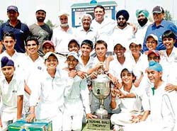 The winning Chandigarh team along with officials in a joyous mood after clinching the Sushil Bali trophy at the PCA Stadium in Mohali