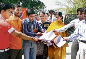 Members of the ABVP burn their degrees in Shimla on Monday, demanding an inquiry into the fake degrees scandal in HP University