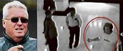 A TV grab shows picture taken with a closed-circuit TV of coach Bob Woolmer (right) talking with two Pakistani journalists before his murder.