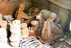 Labourers working in a cycle handle polish unit at Dashmesh Nagar in Ludhiana, which is generating air and noise pollution and playing havoc with the lives of area residents.