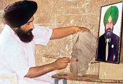 Artist Iqbal Singh Gill at work