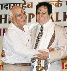 Veteran Bollywood star Dilip Kumar is embraced by director and producer Yash Chopra during the Phalke Ratna Award presentation ceremony organised by the Dadasaheb Phalke Academy in Mumbai on Monday.