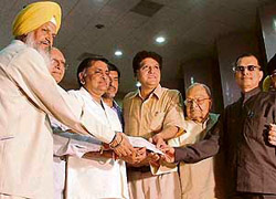 Punjab local bodies, industries and commerce minister Manoranjan Kalia hands over a cheque of capital subsidy to an industrialist in Ludhiana 