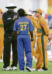 Umpire Steve Bucknor (left) talks to Sri Lankan captain Mahela Jayawardene as Australian skipper Ricky Ponting (right) looks on during the chaotic dying moments of the World Cup final in Bridgetown on Saturday. 