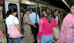 NCC cadets try to control the crowd at Rajiv Chowk Metro Station after a Joint Volunteer Programme between the DMRC and the NCC was launched in the Capital on Tuesday