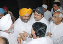 MC councillor HS Bawa argues with Congress workers for not being allowed to step on the stage during a party gathering in Jalandhar.