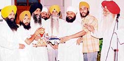 Amarjit Singh Chawla, patron, Sikh Students Federation (Mehta), receives a memento at Mandi Ahmedgarh