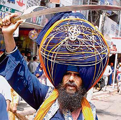 A Nihang at a nagar kirtan on the eve of the birth of Guru Arjan Dev in Amritsar on Tuesday