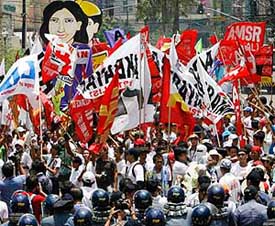 Police block protesters as they attempt to march towards the presidential palace during a Labour Day rally in Manila on Tuesday.