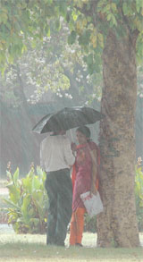 Couple read the book of love in the rain at Rajpath in the Capital.