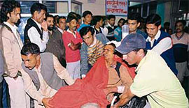 One of the victims of the bus accident at Kotkhai is brought to the IGMC hospital, Shimla, for treatment.