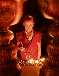 A monk takes part in special prayers at Dorje Duk at Panthaghati, near Shimla, on the occasion of the 2551st birth anniversary of Gautam Buddha.