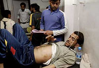 Water Works Department employee Sukhdev Singh, who was injured in a firing by CRPF cop, being shifted to Government Medical College and Hospital in Jammu on Wednesday.