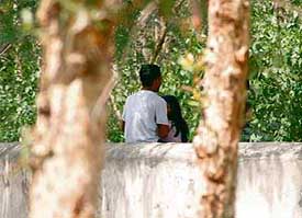A couple in a city garden.