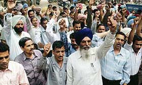 UT Powermen Union members organise a rally against deputy director, Technical Education, Haryana, in Chandigarh