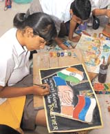 Schoolchildren take part in a painting competition at Russian Centre in the Capita