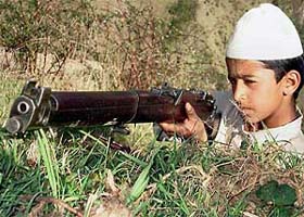 A child member of Village Defence Committee trains at Sabgain village near Poonch