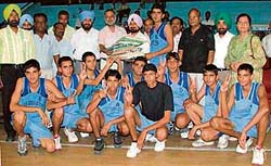 Players of Baba Lodhiana Academy, who retained the title in the 24th Punjab Youth Basketball Championship, which concluded in Ludhiana