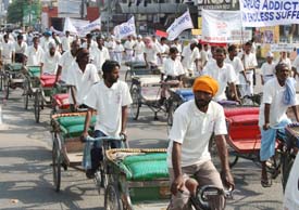 Rickshaw pullers participate in an anti-drug addiction rally organised by Punjab police in Amritsar. 
