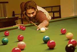 Vikramjeet Singh aims a shot during the 6th Saurabh Khattar Memorial Billiards and Snooker Championship being held at the Chandigarh Club on Thursday.