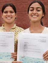 Sapna (left) and Shikha with the Groz Beckert Scholarships Award at Northern India Institute of Fashion Technology in Mohali on Friday.