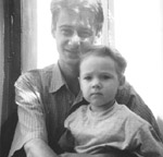 Robert Daniels, shown here with his son in Russia, has highly drug-resistant TB and is practically a prisoner  in court-ordered isolation in Phoenix, Arizona.