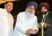  Chief  Minister Parkash Singh Badal inaugurates the subsidy distribution function at Guru Nanak Bhawan in Amritsar on Saturday. Industries minister Manoranjan Kalia and BJP MP Navjot Singh Sidhu were also present on the occasion. 
