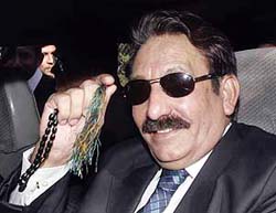 Suspended Chief Justice Iftikhar Chaudhry waves as he leaves his residence in Islamabad to address the Lahore Bar Council