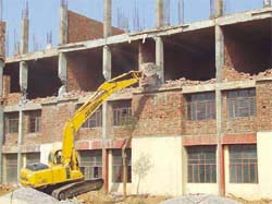 A block of Anupama College of Engineering being razed by the DTP-E department in Gurgaon