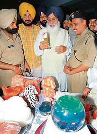 Chief Minister Parkash Singh Badal looks at various articles made by women jail inmates at the Amritsar Central Jail on Sunday.