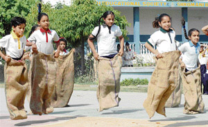 Children participate in sack race during the founders day celebration of Budha Dal Public School in Patiala on Sunday. 