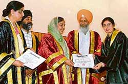 One of the students of Ramgarhia Girls College getting degree from the education minister of Punjab