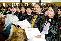 Students in a relaxed mood after receiving their degrees during the annual convocation of the college in Ludhiana on Monday. 