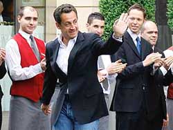 Nicolas Sarkozy, France's newly-elected President, leaves the Fouquet's Hotel in Paris on Monday. 