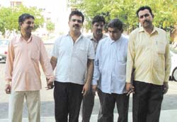 HUDA junior engineer Mohmmed Ali (second from right) and his accomplice Aditya Chopra were arrested while accepting bribe in Gurgaon